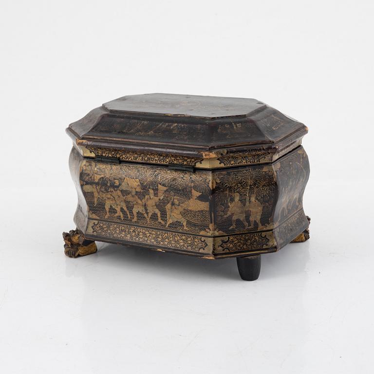 A Chinese lacquered tea caddy with pewter inserts, Qing dynasty, 19th century.