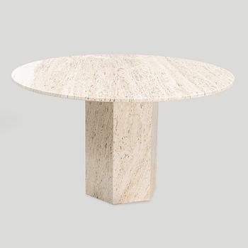 A travertine  'Epic Dining Table' from Gubi.