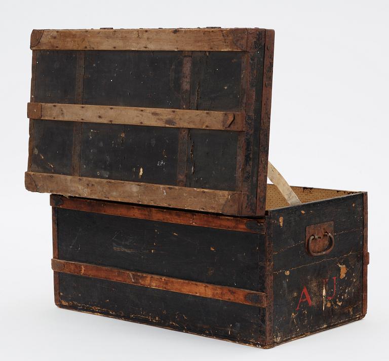 A late 19th century black trunk by Louis Vuitton.