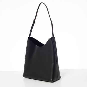 Gucci, A black leather bag.