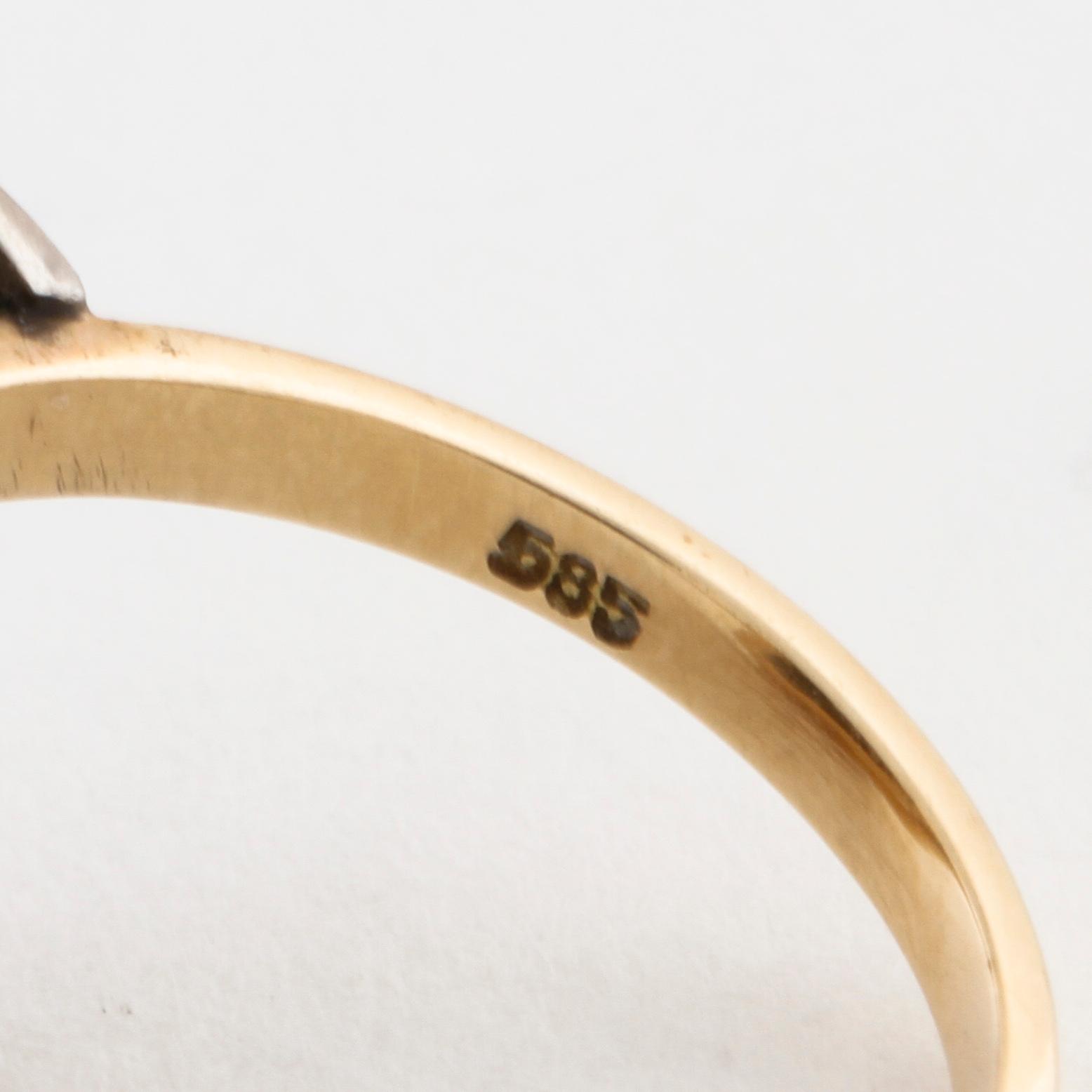 A facet cut diamond ring.