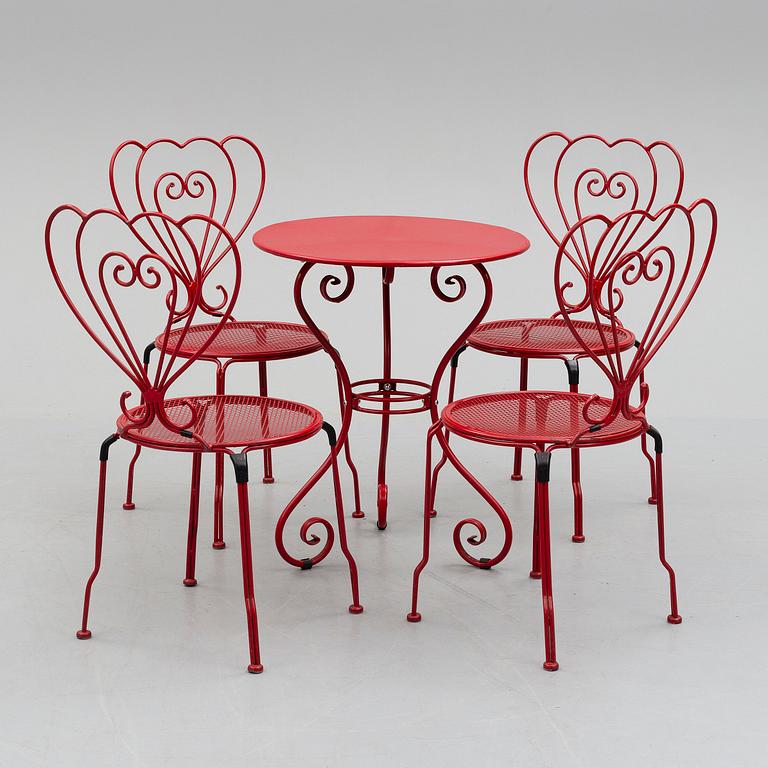 GARDEN FURNITURE, a table and four chairs, late 20th century.