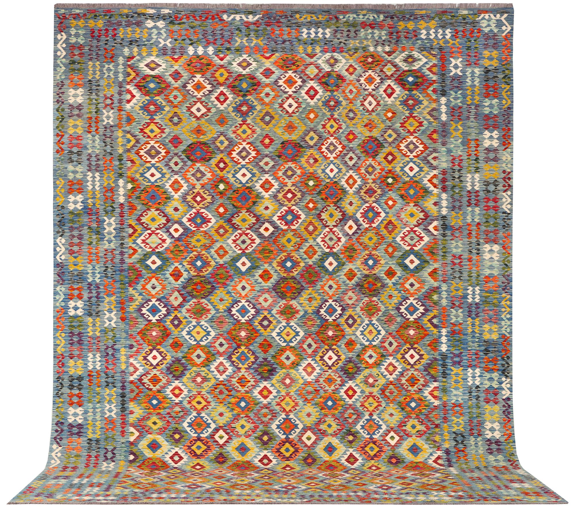 An Afghan kelim carpet, c. 397 x 308 cm.