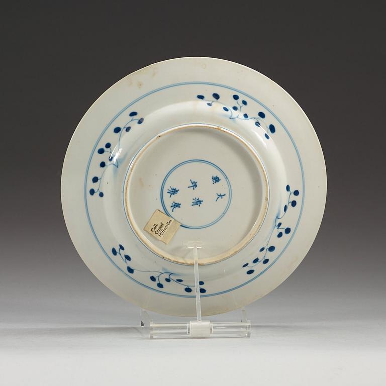 A set of four blue and white dinner plates, Qing dynasty, with Kangxi six character mark and period (1662-1722).