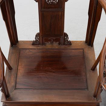 A pair of Chinese horseshoe-back hardwood armchairs, 1900s.