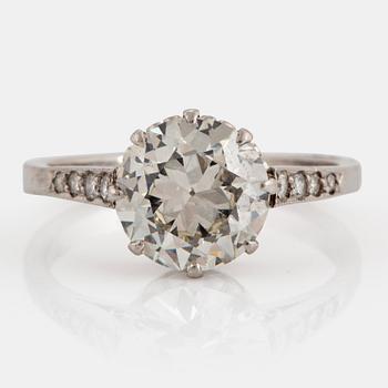 1055. A platinum ring set with an old-cut diamond ca 2.25 cts quality ca K/L vs.