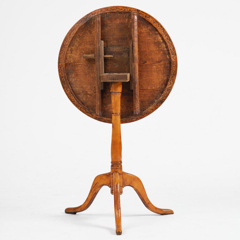 A tilt top table, from around the year 1800.