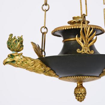 An Empire ormolu and patinated bronze four-light chandelier, Stockholm, early 19th century.