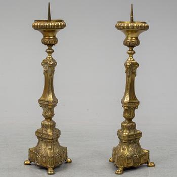 A pair of 18th century brass floor candlesticks.