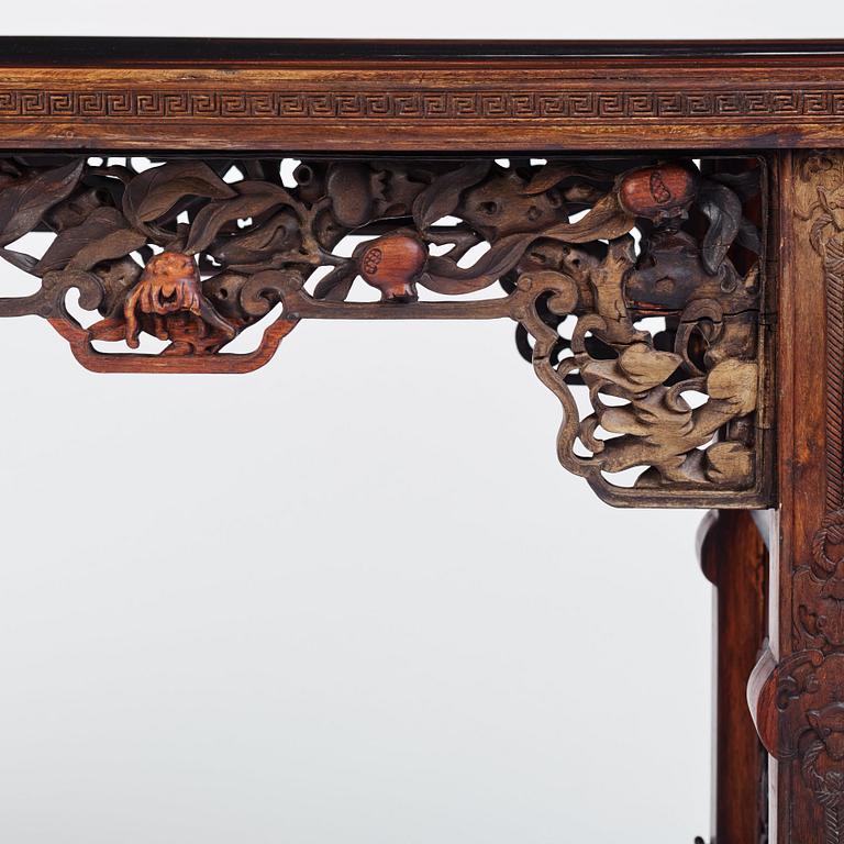 A massive zitan recessed-leg long table 'Jiaotousun Qiotouan', Qing dynasty, 19th century.