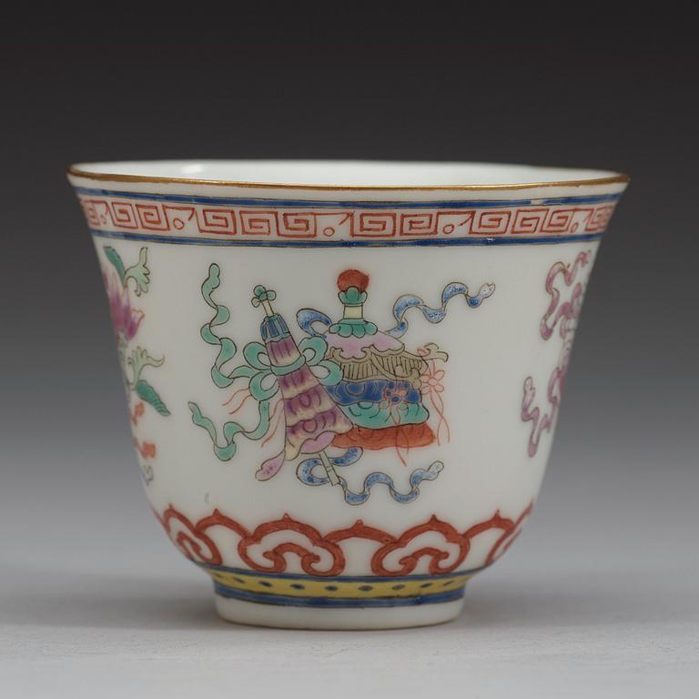 A set of eleven famille rose ba jixiang wine cups, Qing dynasty, with Guangxu six character mark and period (1874-1908).