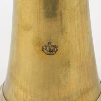 A brass cornet, marked with a crown.