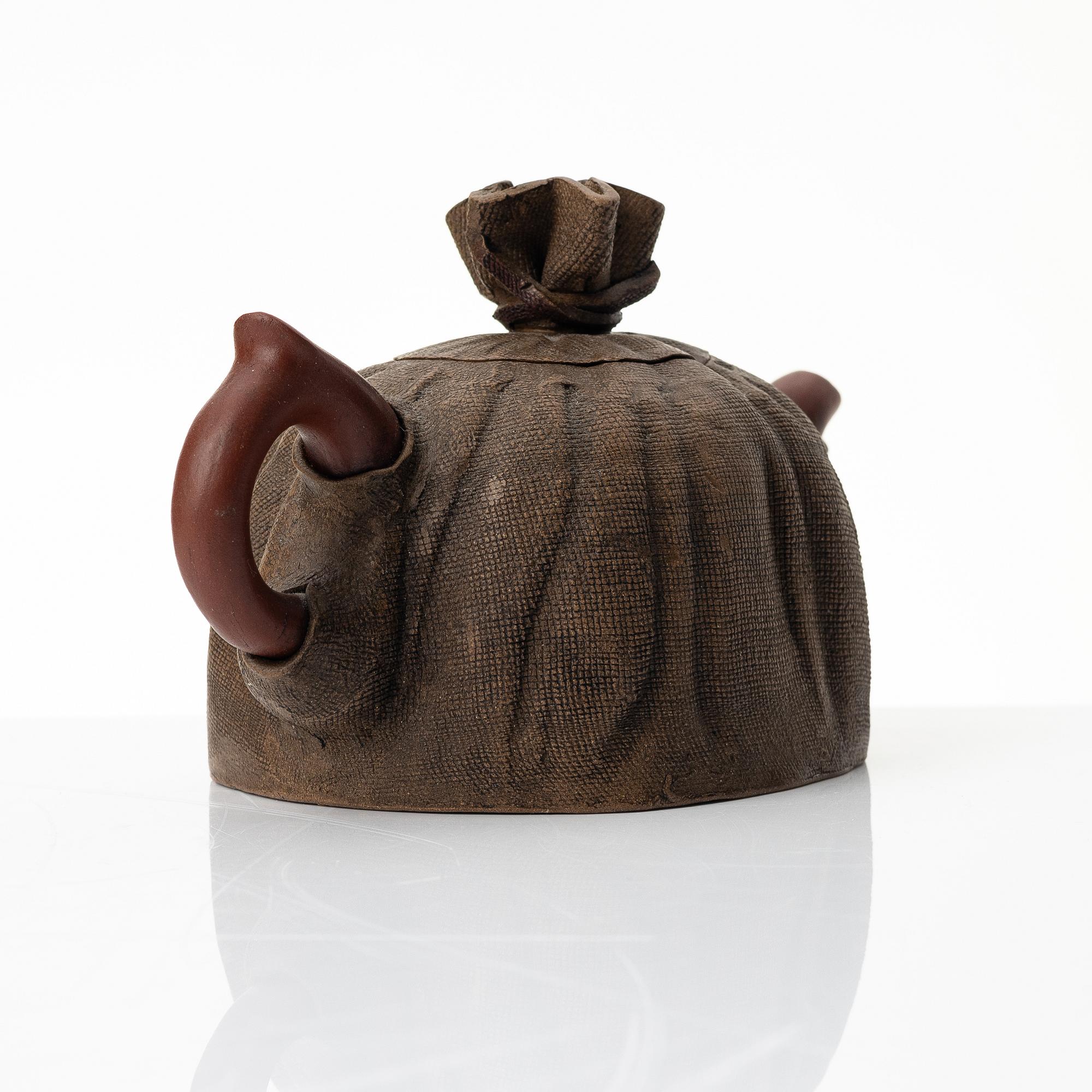Zhou Dingfang, A naturalistic 'sack form' yixing teapot, China, 1990s.