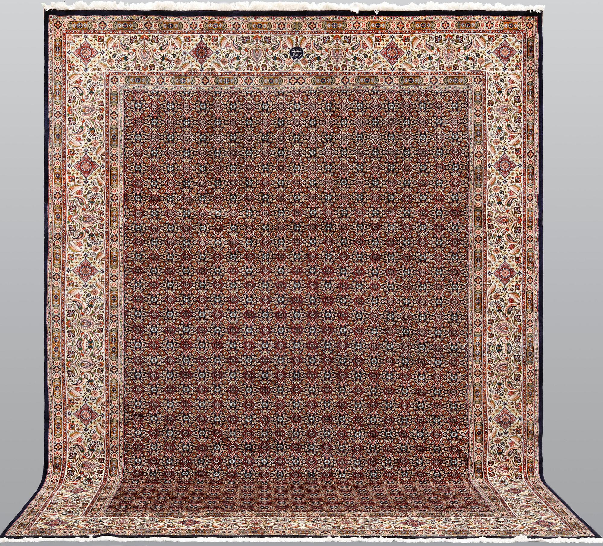 A Moud part silk carpet, signed, 335 x 250 cm.