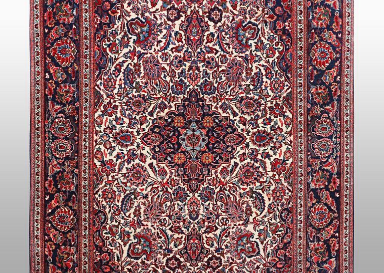 A rug, semi-antique Keshan, 217 x 134 cm.