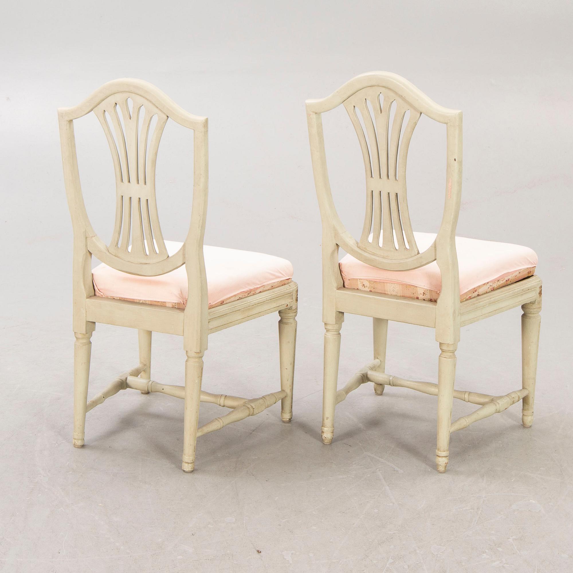 A öpair of painted Gustavian chairs.