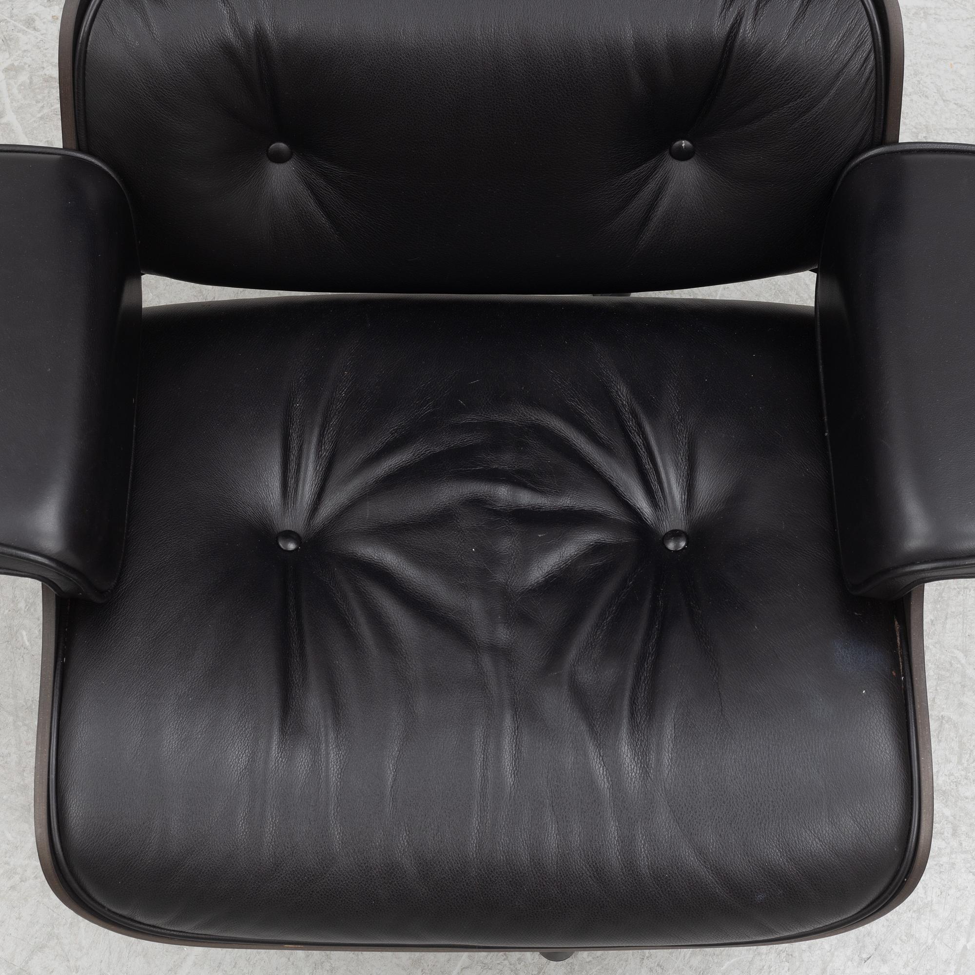 Charles & Ray Eames, an "Eames Lounge Chair" with ottoman, Vitra, 21st century.