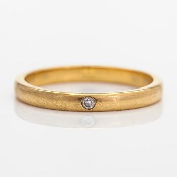 Tiffany & Co, Elsa Peretti, an 18K gold ring, with a small diamond.