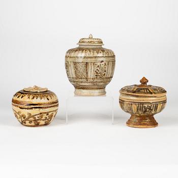 A group of three brown Sawankhalok jars with covers, Thailand, 14th/17th Century.