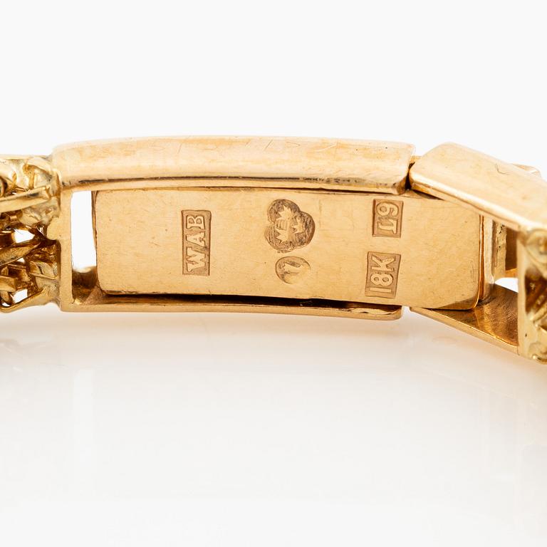 Piaget, armbandsur 18K guld och runda briljantslipade diamanter med länk av W.A. Bolin.