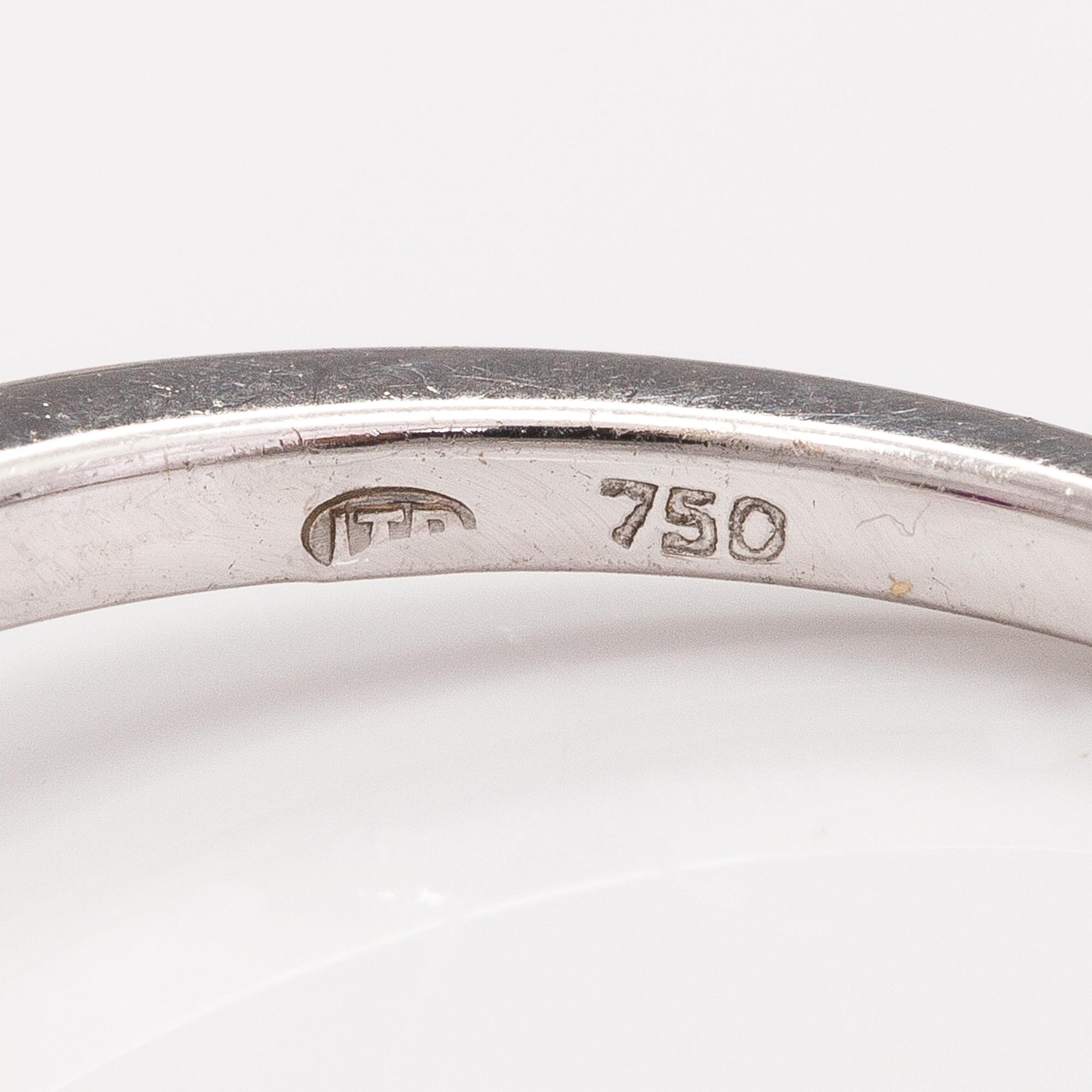 An 18K gold ring with enamel, diamonds ca. o.06 ct in total and a ruby.