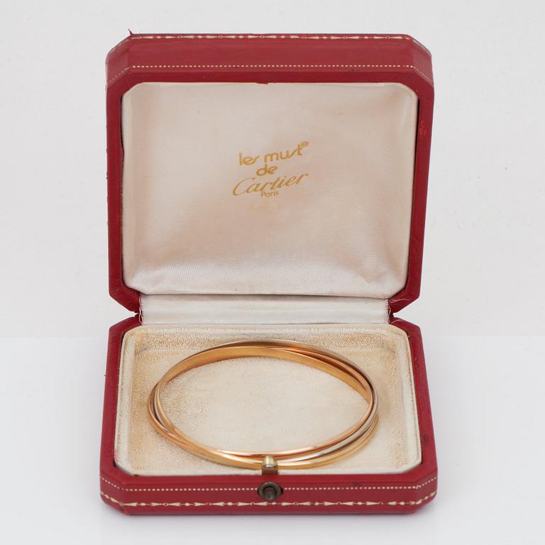 A Cartier "Trinity" bangle. 3 rings.