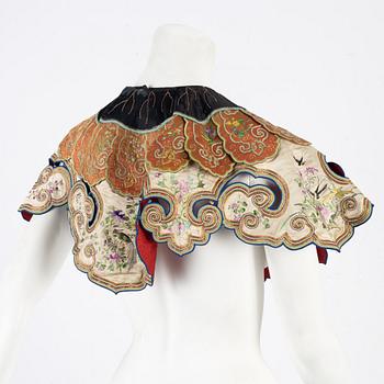 A collar a vest and two Chinese embroidered silk textiles, late Qing dynasty / early 20th century.