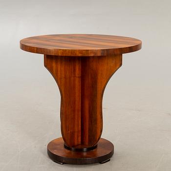 An Art deco style walnut table later part of the 20th century.