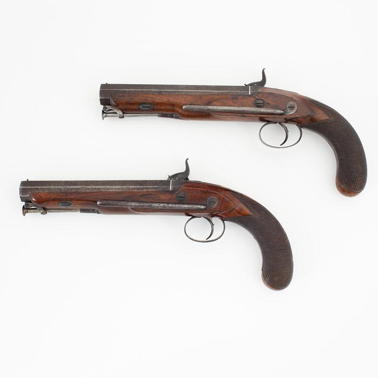 A cased pair of percussion pistols by Westley Richards, London, mid 19th Century.