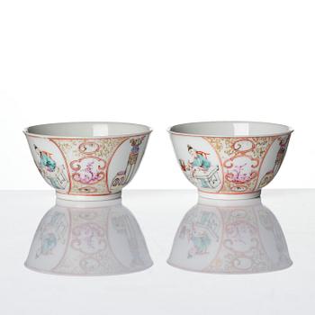 A pair of famille rose 'figural' tea cups with saucers, Qing dynasty, Qianlong (1736-95).