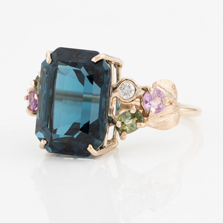 Ring, cocktail ring, with large blue topaz, pink and green tourmalines, and brilliant-cut diamonds.