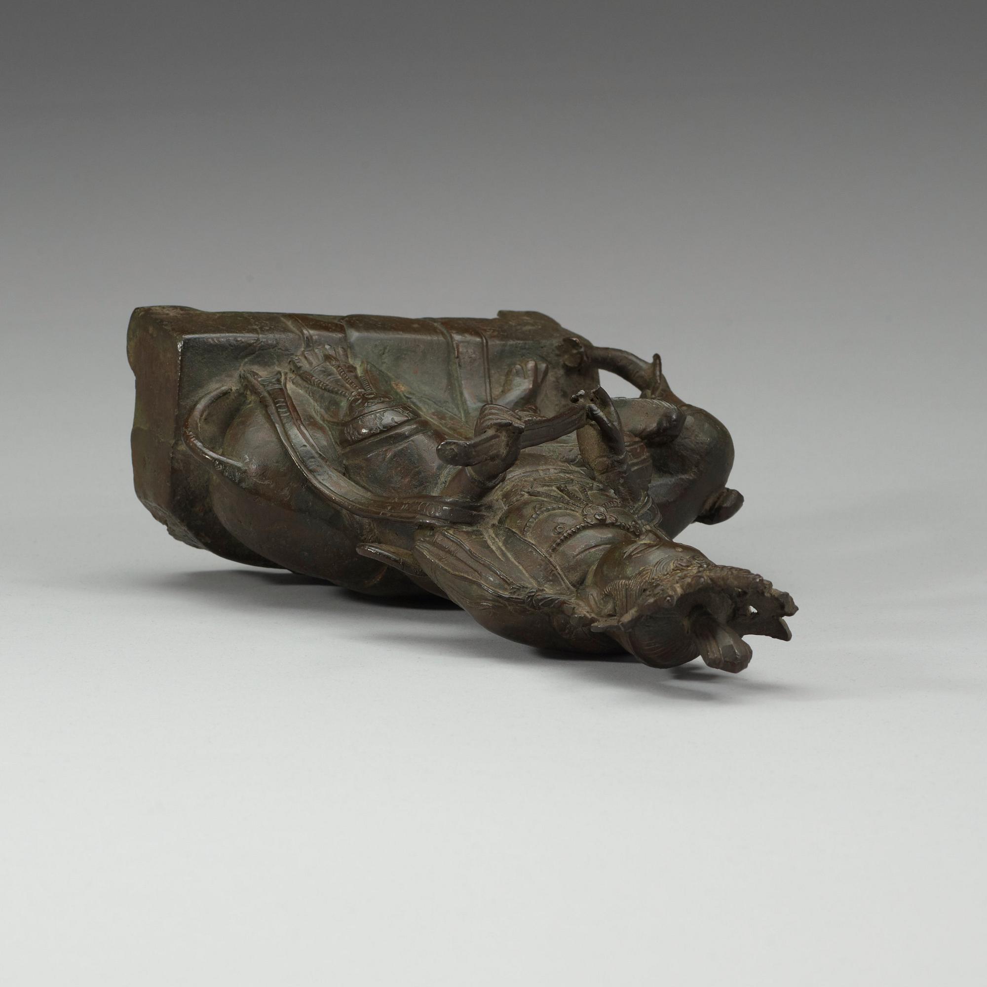 A seated bronze figure of Guanyin on an elephant, Qing dynasty, 19th Century.