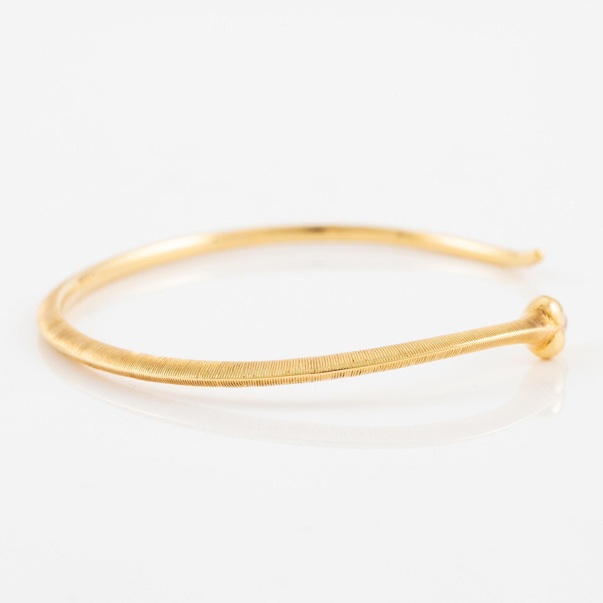 An Ole Lynggaard bracelet 18K gold in the shape of a snake.