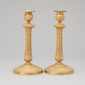 A pair of French Empire early 19th century candlesticks.