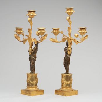 A pair of Louis XVI circa 1800 three-light candelabra.