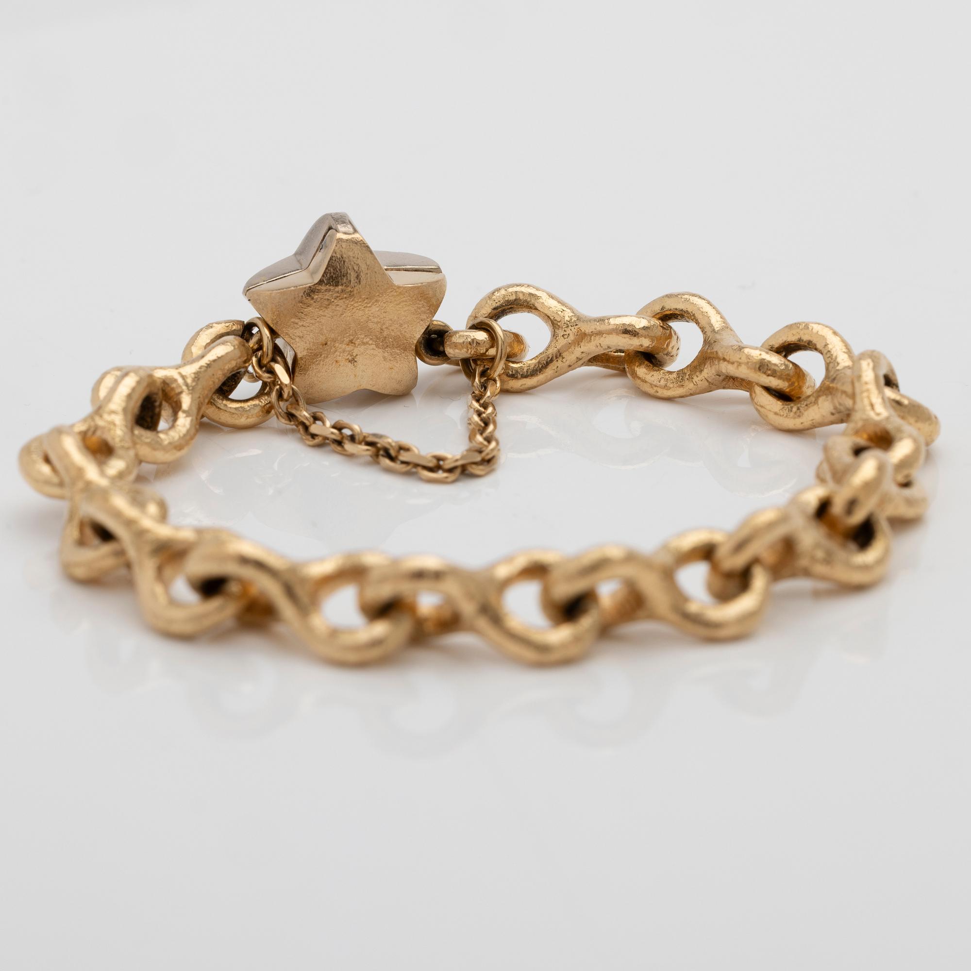 Armband 18K guld med en diamant.
