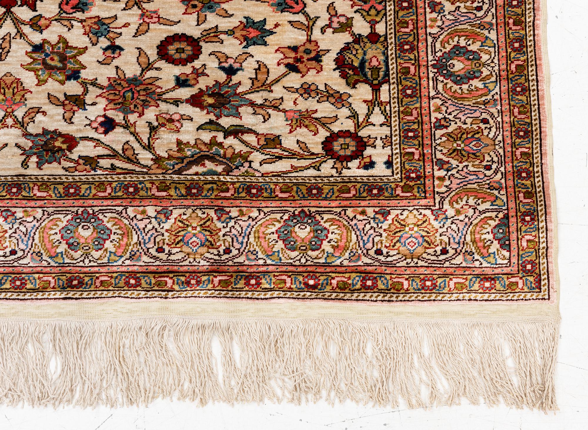 An Oriental silk rug, c. 122 x 76 cm.