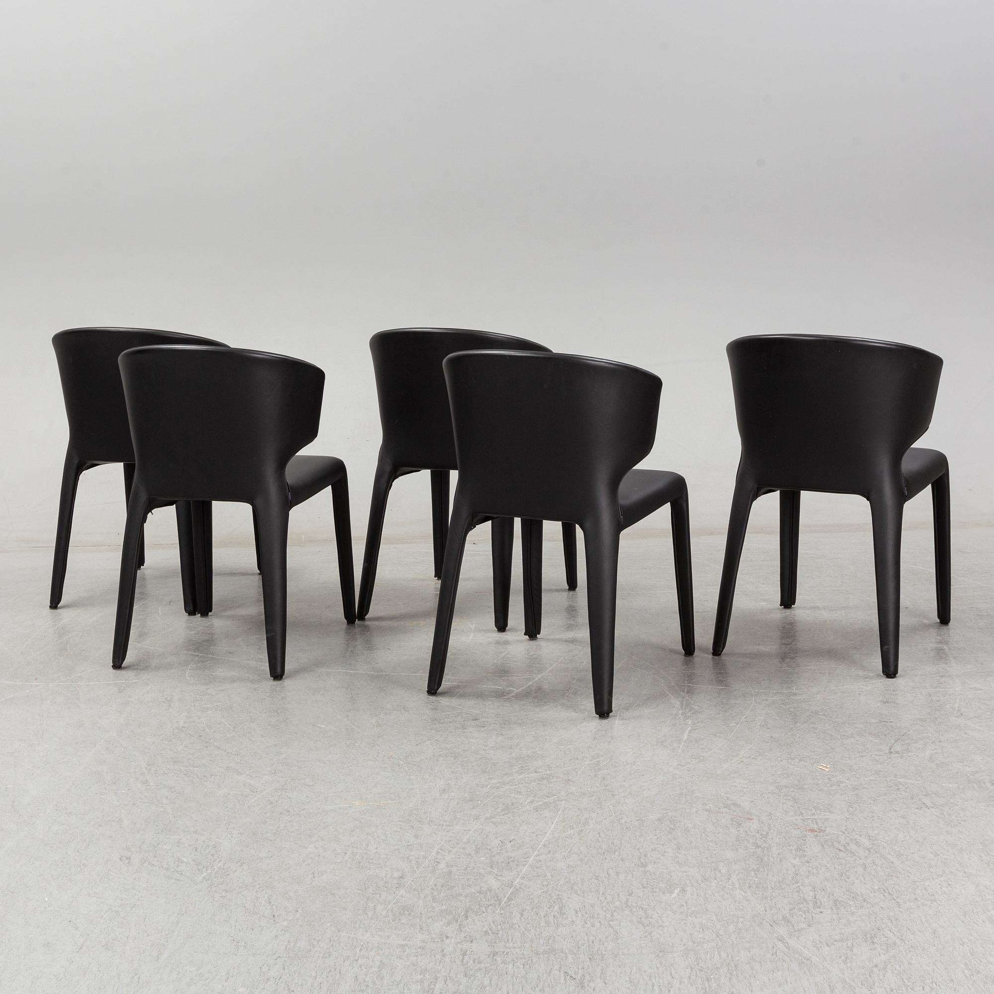 A set of five Hannes Wettstein 'Hola' black leather chairs, model 367, Cassina, Italy.