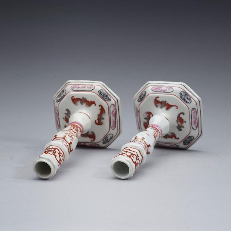 A pair of famille rose candle sticks, Qing dynasty, Qianlong (1736-95).