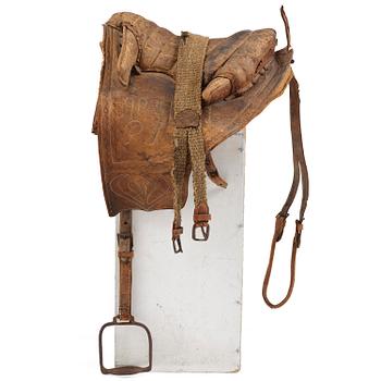 293. A leather saddle of Caucasian type, dated 1821.