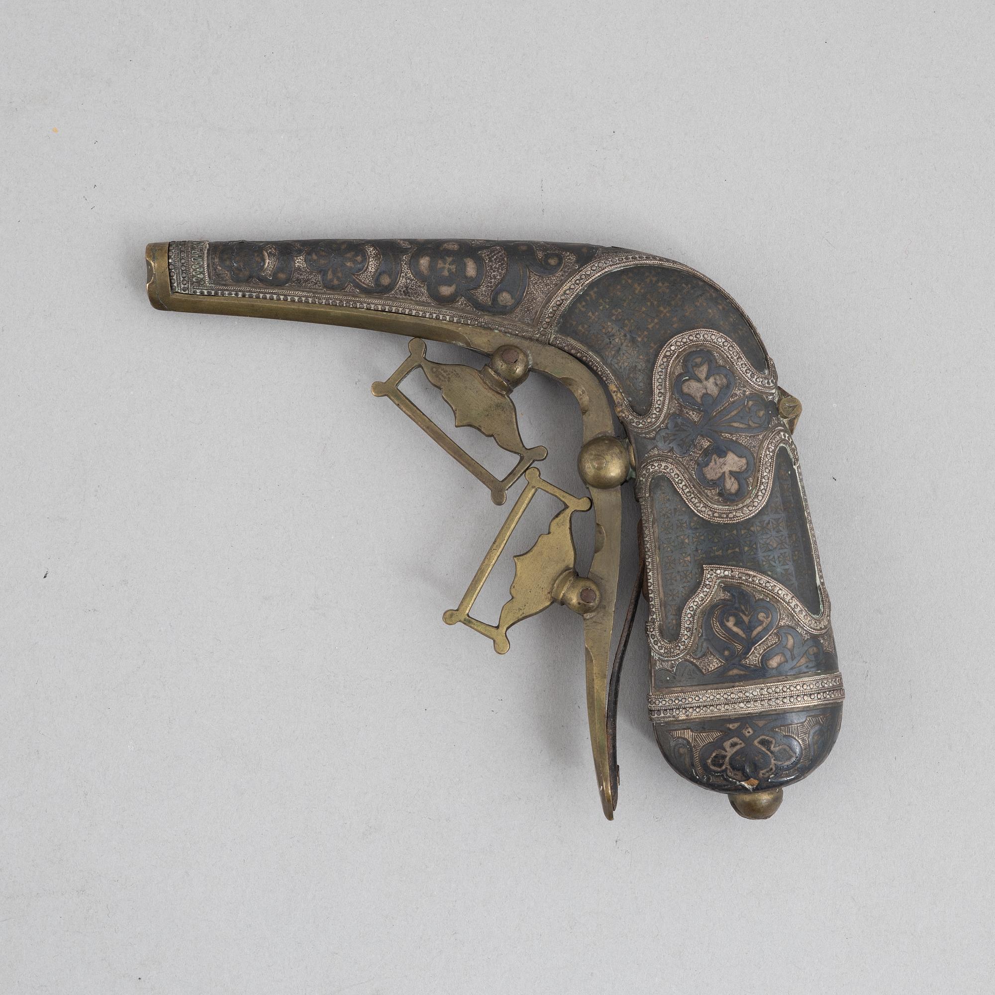 A Caucasian priming flask.
