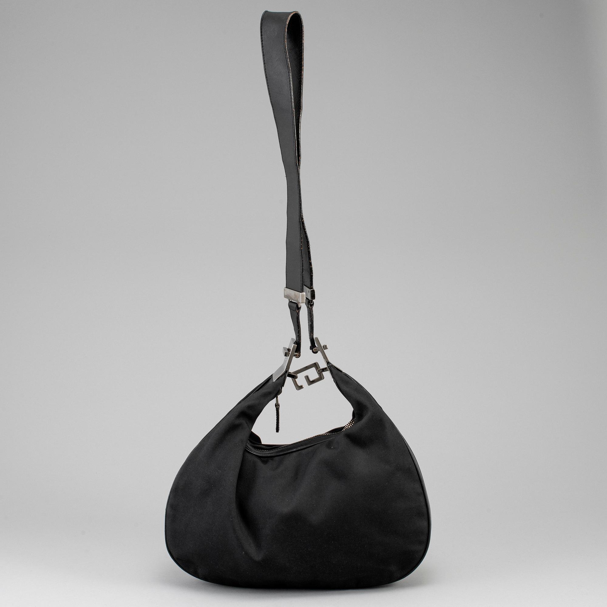 GUCCI, a canvas handbag.