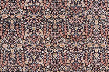 A signed Hereke carpet, ca 340 x 246 cm.