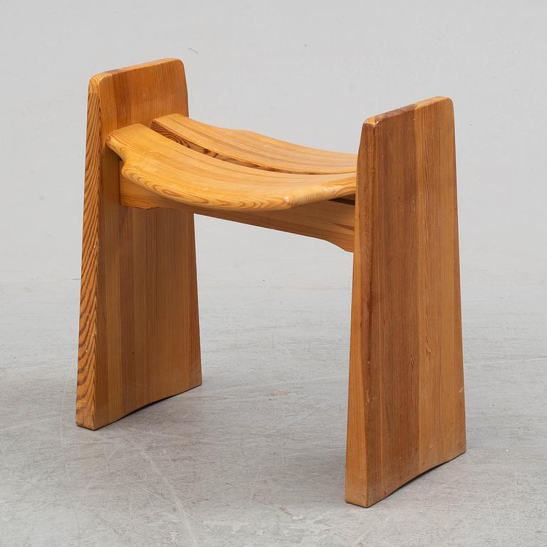 A pine bench by Gilbert Marklund.
