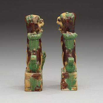 A pair of bisquit joss stick holders in the shape of buddhist lions, Qing dynasty, Kangxi (1662-1722).