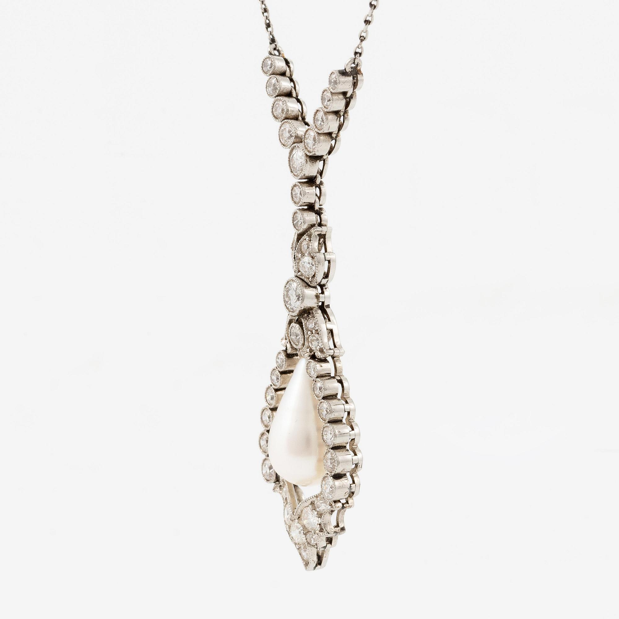 A platinum necklace with a drop-shaped pearl.