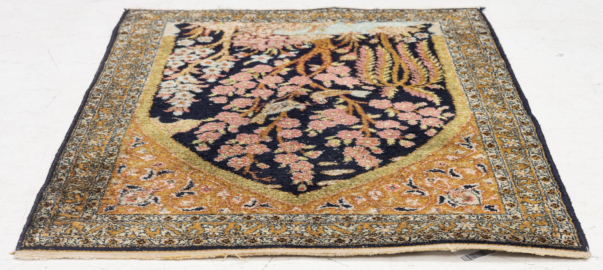A semi-antique silk Ghom rug, central Iran, c. 32 x 23 in.