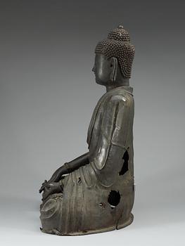 A large bronze figure of Buddha.