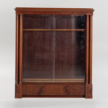 An Empire style bookcase, first half of the 20th Century.