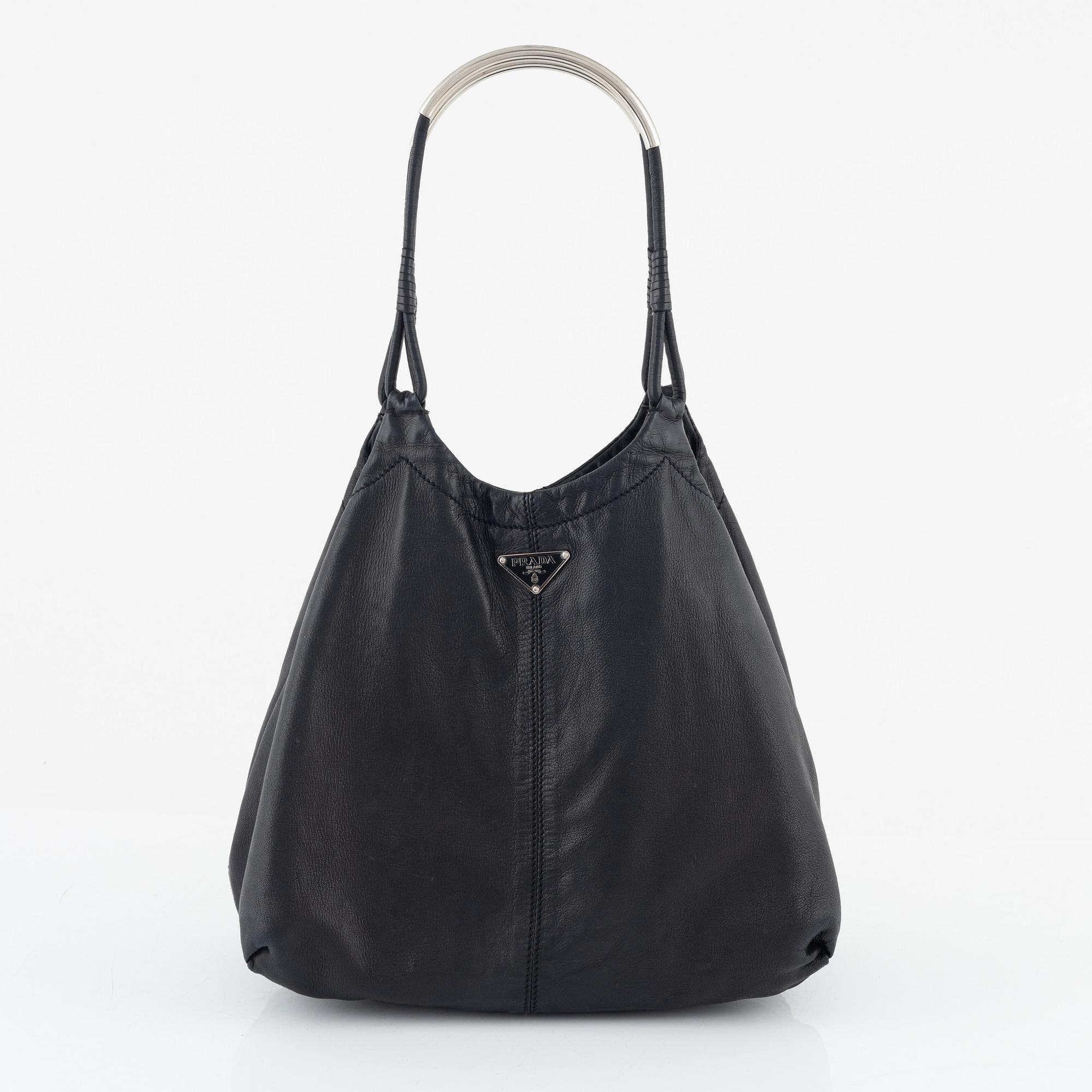 Prada, A black leather bag.